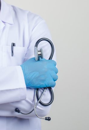 doctor-crossing-arms-while-holding-stethoscope-white-coat